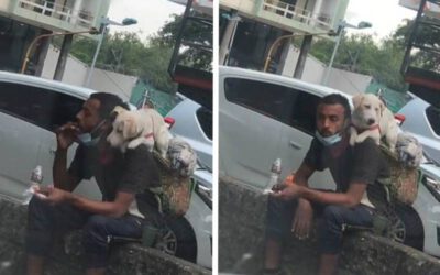 Vendedor ambulante divide o pouco alimento que tem com o seu cãozinho